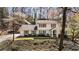 Charming two-story traditional home with a well-maintained lawn and mature trees at 440 River Valley Rd, Atlanta, GA 30328