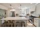 Well-lit kitchen with a center island, stainless steel appliances and white cabinetry at 440 River Valley Rd, Atlanta, GA 30328