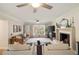 Bright living room with fireplace, hardwood floors and ceiling fan at 440 River Valley Rd, Atlanta, GA 30328