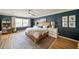 Stylish primary bedroom features ample natural light, hardwood floors and ceiling fan at 440 River Valley Rd, Atlanta, GA 30328