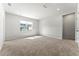 Empty bedroom with neutral walls, carpeted floors, and ample natural light at 4779 Mock Orange Sw St, Atlanta, GA 30331