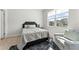 Cozy bedroom features a plush rug, armchair, and natural light at 4779 Mock Orange Sw St, Atlanta, GA 30331