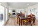 View of dining area showing the transition to the living room and a glimpse of the stairs at 4779 Mock Orange Sw St, Atlanta, GA 30331