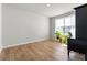 Bright living area showcasing hardwood floors, a large window, and ample space at 4779 Mock Orange Sw St, Atlanta, GA 30331