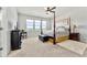 Spacious bedroom with a four-poster bed, ample natural light, and cozy carpeting at 4779 Mock Orange Sw St, Atlanta, GA 30331