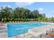 Inviting swimming pool surrounded by lounge chairs and lush landscaping, perfect for relaxation at 4779 Mock Orange Sw St, Atlanta, GA 30331