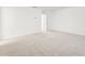 Large bedroom featuring plush carpet, crisp white walls, and neutral decor at 1115 Lockhart Way, Douglasville, GA 30135