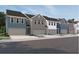 Charming townhome community featuring craftsman-style architecture and attached garages at 1115 Lockhart Way, Douglasville, GA 30135