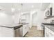 Contemporary kitchen island and stainless steel appliances at 1115 Lockhart Way, Douglasville, GA 30135