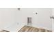 Laundry room featuring a washing machine hookup and lovely laminate floors at 1115 Lockhart Way, Douglasville, GA 30135