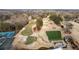 An aerial view of the golf course highlighting its meticulously designed greens, sand traps, and pristine landscaping at 1380 Tennis Court Pl, Roswell, GA 30075