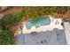 Aerial view of a private backyard with a pool, hot tub, and patio furniture at 1380 Tennis Court Pl, Roswell, GA 30075
