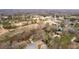 Aerial view of property's neighborhood with golf course, tennis courts and tree-lined streets at 1380 Tennis Court Pl, Roswell, GA 30075