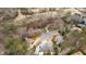 Aerial view of residential area with golf course, tennis courts and tree-lined streets at 1380 Tennis Court Pl, Roswell, GA 30075