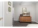 Bedroom with dresser and wall decorations, offering a peaceful and relaxing space at 1380 Tennis Court Pl, Roswell, GA 30075