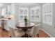 Cozy breakfast nook next to the kitchen area with round table, chairs, and window shutters at 1380 Tennis Court Pl, Roswell, GA 30075