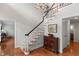 Inviting foyer with hardwood floors, elegant staircase, and classic decor for a grand entrance at 1380 Tennis Court Pl, Roswell, GA 30075
