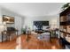 Spacious home office with hardwood floors, natural light, and ample workspace for productivity at 1380 Tennis Court Pl, Roswell, GA 30075
