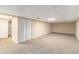 Spacious basement room featuring neutral carpeting, walls and bifold closet at 3552 Meadowview Dr, Lithia Springs, GA 30122