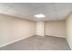 Finished basement features neutral carpet, walls and ceilings, and good lighting at 3552 Meadowview Dr, Lithia Springs, GA 30122