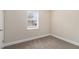 Cozy bedroom with plush carpeting, neutral walls, and a bright window at 3552 Meadowview Dr, Lithia Springs, GA 30122