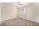 Comfortable bedroom with plush carpeting and a bright window at 3552 Meadowview Dr, Lithia Springs, GA 30122