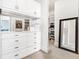 Custom closet featuring built-in drawers, shelves, and mirrors for optimal storage at 1065 Peachtree Ne St # 3105, Atlanta, GA 30309