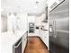 Modern kitchen with stainless steel appliances and white cabinetry, featuring a marble island at 1065 Peachtree Ne St # 3105, Atlanta, GA 30309