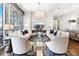 Open-concept living room with hardwood floors, fireplace, modern decor, and city views at 1065 Peachtree Ne St # 3105, Atlanta, GA 30309