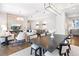 Spacious living and dining room area with hardwood floors, city views, and designer furnishings at 1065 Peachtree Ne St # 3105, Atlanta, GA 30309