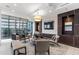 A stylish lounge featuring comfortable seating, a large TV, and city views at 1065 Peachtree Ne St # 3105, Atlanta, GA 30309