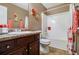 Bathroom featuring a shower/tub combo with a shower curtain and dark wood cabinets at 2258 Bigwood Trail Trl, Atlanta, GA 30349