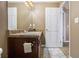 Bathroom featuring a vanity with dark wood cabinets and a decorative rug on the floor at 2258 Bigwood Trail Trl, Atlanta, GA 30349