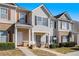 Attractive townhome with complementary siding, shutters, manicured landscaping, and inviting curb appeal at 2258 Bigwood Trail Trl, Atlanta, GA 30349