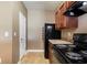 Efficient kitchen with a black refrigerator and stove at 2258 Bigwood Trail Trl, Atlanta, GA 30349