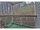 Relaxing balcony with black metal railing with a view of surrounding trees and nature at 4206 Santa Fe Pkwy, Atlanta, GA 30350