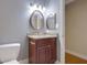 Stylish bathroom featuring a modern vanity with granite countertops, framed mirror, and modern fixtures at 4206 Santa Fe Pkwy, Atlanta, GA 30350