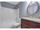 Well-appointed bathroom showcasing a vanity with a granite countertop, bathtub, and shower combination at 4206 Santa Fe Pkwy, Atlanta, GA 30350