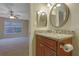 Bathroom with granite vanity and decorative mirror conveniently located off the bedroom at 4206 Santa Fe Pkwy, Atlanta, GA 30350