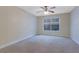 Bedroom featuring neutral walls, carpet, ceiling fan, and a window offering natural light, enhancing the inviting atmosphere at 4206 Santa Fe Pkwy, Atlanta, GA 30350