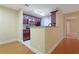 Well-lit kitchen features stainless steel appliances, granite countertops, and wood floors in the adjacent dining area at 4206 Santa Fe Pkwy, Atlanta, GA 30350