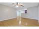 Open-concept living area with gleaming hardwood floors and a seamless transition to the adjacent kitchen area at 4206 Santa Fe Pkwy, Atlanta, GA 30350