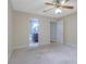 Main bedroom with neutral carpet with doorways to ensuite bath and walk-in closet at 4206 Santa Fe Pkwy, Atlanta, GA 30350