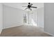 Cozy bedroom features a ceiling fan, double closet and natural light from a large window at 8026 Rivermont Ct, Snellville, GA 30039