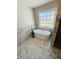 Modern bathroom with a freestanding tub, marble walls, and a large window at 900 Ira Sw St, Atlanta, GA 30310