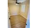 Small bedroom with a window, ceiling fan, neutral paint, and wood-look laminate flooring at 900 Ira Sw St, Atlanta, GA 30310