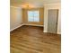 Bright dining room with hardwood floors, a modern light fixture and window at 900 Ira Sw St, Atlanta, GA 30310