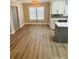 Dining area showcasing hardwood floors, lighting, and a view into the kitchen at 900 Ira Sw St, Atlanta, GA 30310