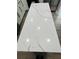 Close-up of kitchen island featuring a white countertop with marbled design at 900 Ira Sw St, Atlanta, GA 30310