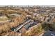 An aerial view of townhomes with a city skyline and mature trees surrounding the property at 1376 Stirling Nw Cir, Atlanta, GA 30318